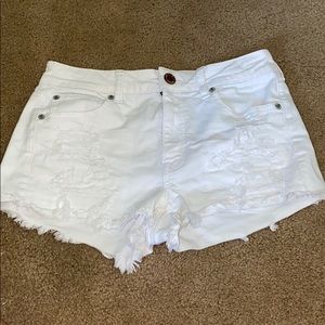 White ripped jean shorts